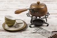 Wipe fondue fuel spills quickly to minimize damage to your table.