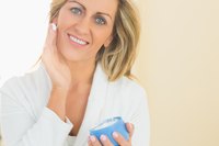 Woman trying out face cream.