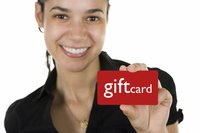 Woman holding a gift card.