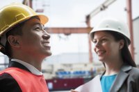 Two engineers working together on a job site.