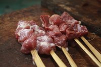 Goat meat being sautéed on grill