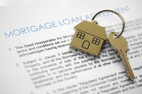 Mortgage contract with key to house.