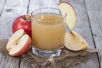 Drink raw apple juice for its higher vitamin C content compared to pasteurized juice.