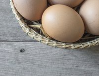 A basket filled with brown eggs.