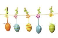 Tie cute ribbons through decorated plastic eggs for Easter decor.