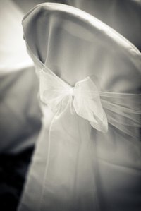 Heavy fabric can completely cover a folding chair.