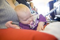 Book flights that coincide with her nap time.