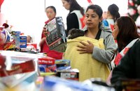 Salvation Army volunteers handing out toys to families in need.