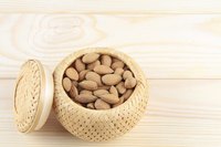Almonds on a wooden table.