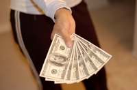 A woman holding cash in her hand.