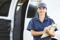 Delivery woman with a clipboard wearing a uniform.