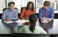 Four business people are in a meeting.