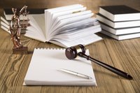 Close up of a gavel and legal documents