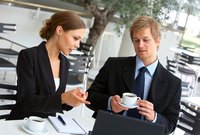 Young man and woman working in office