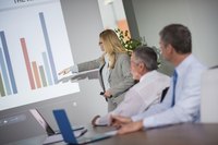Woman giving presentation with help of computer