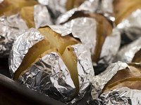 Baked poatoes on a tray.