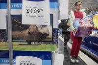 Consumers selecting products in a retail store.