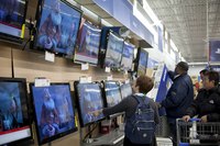 Customers shopping for electronics in a superstore.