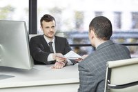 Image of two men in an interview.