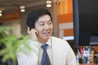Smiling HR employee using headset.