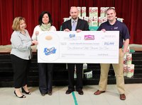 A committee receiving an award for a successful fundraiser
