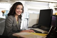 Woman working in front of a computer.