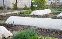Securing covers' edges with soil gives the best freeze protection.