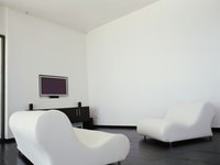Extend a wall to enclose a room.