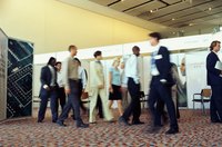 Business people are walking at a trade show.