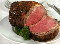 An initial higher oven temperature develops the characteristic crust on a prime rib roast.