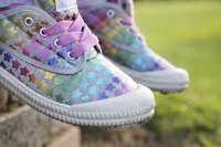 Painted stars on canvas shoe.