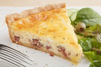 Crusty bread and a crisp salad are the quiche's usual accompaniments.