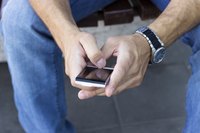 Close-up of a man holding a smartphone