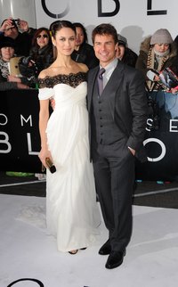 Tom Cruise pairs a gray shirt with black shoes at the "Oblivion" UK film premiere in London, England in 2013.