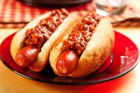 Add a little tomato paste to keep the chili thick and red.
