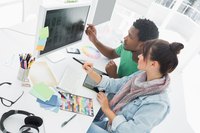 Two designers working on a new logo