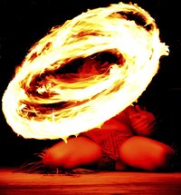The Samoan fire dance is the grand finale at many commercial luau.