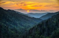 The sun sets over the hills of Great Smoky Mountains National Park.