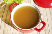 Fat-free broth is clear and transparent with little to no iridescent film on top.