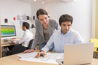 Marketing professionals use computer technology to manage campaigns.