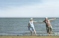Senior couple dancing at the water's edge