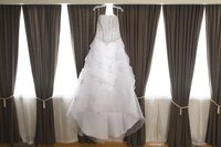 Hang a wedding dress to dry rather than risk damage in a dryer.