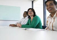 People sitting around a conference table.