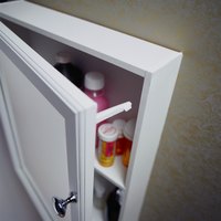 Recessed medicine cabinets sit in the drywall.