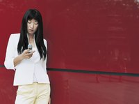 Young woman texting on her phone