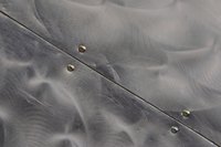 Brush steel to give it added texture.