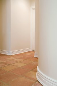 Lay ceramic tile over an encapsulated VCT floor.