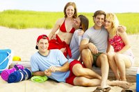 Families take affordable trips to the beach during a recession instead of an expensive vacation.