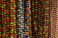 Huichol jewelry uses fine seed beads to create intricate patterns.