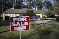 House with "for sale" sign.